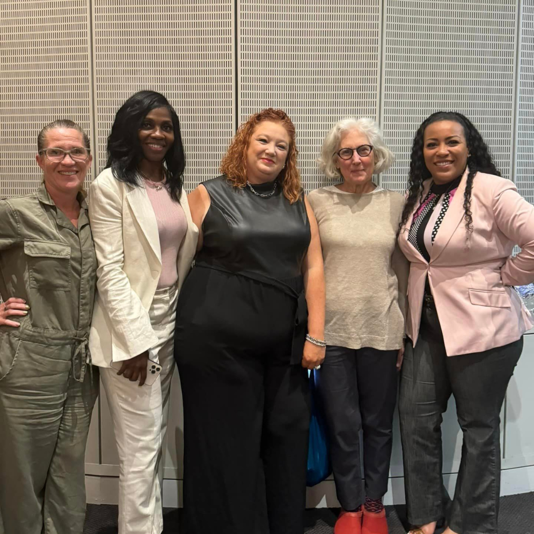 Cynthia and other event leaders pose for a photo together